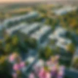 Aerial view of the Green Community showcasing lush greenery and modern homes